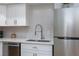 Well-lit kitchen with new stainless steel appliances and clean white cabinetry at 1701 E Katie Ave # 68, Las Vegas, NV 89119