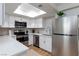 Modern kitchen with stainless steel appliances, white cabinets, and bright countertops at 1701 E Katie Ave # 68, Las Vegas, NV 89119