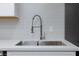 Close up of new stainless steel sink and updated backsplash in a modern kitchen at 1701 E Katie Ave # 68, Las Vegas, NV 89119