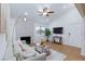 Bright living room featuring a ceiling fan, modern decor, and a decorative fireplace at 1701 E Katie Ave # 68, Las Vegas, NV 89119
