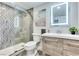 Modern bathroom with walk-in shower, updated vanity and wood look tile at 1701 E Katie Ave # 9, Las Vegas, NV 89119