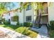 Charming building exterior with green landscaping, steps to the unit's front door at 1701 E Katie Ave # 9, Las Vegas, NV 89119