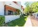 Building exterior with iron decor, green landscaping, and a sidewalk at 1701 E Katie Ave # 9, Las Vegas, NV 89119