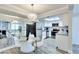 Open concept kitchen and dining room with stainless steel appliances, granite countertops, and modern lighting at 1701 E Katie Ave # 9, Las Vegas, NV 89119