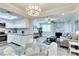 Bright living space featuring updated kitchen, adjacent dining area, and fireplace with decorative stone accent wall at 1701 E Katie Ave # 9, Las Vegas, NV 89119