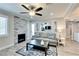Inviting living room with a decorative fireplace, modern decor, and ceiling fan at 1701 E Katie Ave # 9, Las Vegas, NV 89119