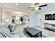 Bright living room features modern decor, open layout to dining, and a ceiling fan at 1701 E Katie Ave # 9, Las Vegas, NV 89119