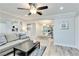 Comfortable living room area with updated flooring, modern decor and a ceiling fan at 1701 E Katie Ave # 9, Las Vegas, NV 89119