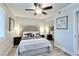 Comfortable main bedroom features ceiling fan, ensuite and natural light at 1701 E Katie Ave # 9, Las Vegas, NV 89119