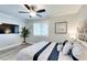 Cozy primary bedroom features ceiling fan, natural light, a TV and minimalist décor at 1701 E Katie Ave # 9, Las Vegas, NV 89119