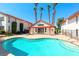 Community pool with lounging area surrounded by well-maintained landscaping at 1701 E Katie Ave # 9, Las Vegas, NV 89119