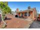 Cozy backyard featuring a covered patio, barbecue, and a small tree at 1951 Raspberry Hill Rd, Las Vegas, NV 89142