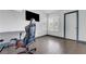 Bedroom with laminate flooring, a desk and chair, and natural light from a window at 1951 Raspberry Hill Rd, Las Vegas, NV 89142