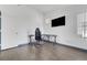 Bedroom with laminate flooring, a desk and chair, and natural light from a window at 1951 Raspberry Hill Rd, Las Vegas, NV 89142