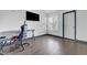 Bedroom with laminate flooring, a desk and chair, and natural light from a window at 1951 Raspberry Hill Rd, Las Vegas, NV 89142