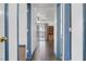 Hallway with doors leading to multiple rooms and tile flooring at 1951 Raspberry Hill Rd, Las Vegas, NV 89142