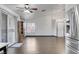Open living room with vaulted ceilings, wood flooring, and sliding glass doors for indoor/outdoor living at 1951 Raspberry Hill Rd, Las Vegas, NV 89142