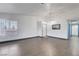Spacious living area features tile flooring, modern lighting, an adjacent dining space and a white door at 1951 Raspberry Hill Rd, Las Vegas, NV 89142