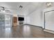 Spacious living area featuring a fireplace with media center, an adjacent dining space, and a white door at 1951 Raspberry Hill Rd, Las Vegas, NV 89142
