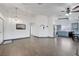 Spacious living area next to the kitchen features tile flooring, modern lighting and stainless steel appliances at 1951 Raspberry Hill Rd, Las Vegas, NV 89142