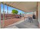 Backyard patio features a shade structure, table, chairs and desert landscaping at 1951 Raspberry Hill Rd, Las Vegas, NV 89142