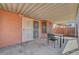 Covered patio with seating outside of the main house at 1951 Raspberry Hill Rd, Las Vegas, NV 89142