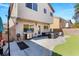 Backyard with a patio, outdoor seating, grill, basketball hoop and manicured artificial lawn at 232 Dog Leg Dr, Las Vegas, NV 89148