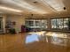Well-lit fitness center featuring wood floors, mirrored walls, large windows, and workout equipment at 232 Dog Leg Dr, Las Vegas, NV 89148