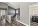 Upstairs hallway leading to a laundry room and other rooms in the house at 232 Dog Leg Dr, Las Vegas, NV 89148
