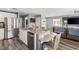 Open kitchen with stainless steel appliances, ample counter space, and a breakfast bar at 232 Dog Leg Dr, Las Vegas, NV 89148