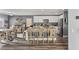 Open kitchen features granite countertops, stainless appliances, and a dining area at 232 Dog Leg Dr, Las Vegas, NV 89148