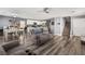 Open-concept living and dining area with hard wood floors and recessed lighting at 232 Dog Leg Dr, Las Vegas, NV 89148