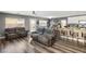 Open-concept living and dining area, featuring wood floors and easy kitchen access at 232 Dog Leg Dr, Las Vegas, NV 89148