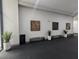 Modern lobby with bench seating, potted plants, and decorative wall art at 232 Dog Leg Dr, Las Vegas, NV 89148