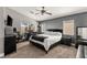 Serene main bedroom with a ceiling fan, natural light, and plenty of space at 232 Dog Leg Dr, Las Vegas, NV 89148