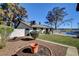 Landscaped backyard with potted plants and mature trees at 2381 Marion St, Las Vegas, NV 89104
