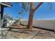 Landscaped backyard with mature trees and partial patio at 2381 Marion St, Las Vegas, NV 89104