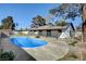 Fenced pool area with patio and mature trees at 2381 Marion St, Las Vegas, NV 89104