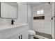 Bathroom features a glass shower enclosure with marble tile, a built-in dark tiled niche, and a modern vanity at 2381 Marion St, Las Vegas, NV 89104