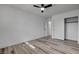 Bright bedroom features wood floors, recessed lighting, ceiling fan and a closet for added storage space at 2381 Marion St, Las Vegas, NV 89104