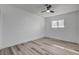 Bright bedroom boasts wood floors, recessed lighting, ceiling fan, and a window for plenty of natural light at 2381 Marion St, Las Vegas, NV 89104