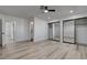 Spacious bedroom featuring wood floors and mirrored closet doors at 2381 Marion St, Las Vegas, NV 89104