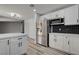 A bright kitchen with stainless steel appliances and white cabinets at 2381 Marion St, Las Vegas, NV 89104