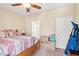 Cozy bedroom with a ceiling fan, natural light, and ample space for relaxation and storage at 2612 Tullamore Creek Ln, Laughlin, NV 89029