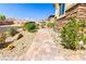 Paver walkway leading up to a home with a beautifully landscaped, low-maintenance yard at 2612 Tullamore Creek Ln, Laughlin, NV 89029