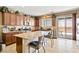 Well-lit kitchen with granite countertops, stainless steel appliances, and a breakfast bar with seating at 2612 Tullamore Creek Ln, Laughlin, NV 89029