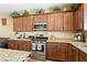 Kitchen area showcasing stainless steel appliances, granite countertops, and plenty of cabinet space at 2612 Tullamore Creek Ln, Laughlin, NV 89029