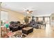 Spacious living room with an open floor plan, ceiling fan, and natural light at 2612 Tullamore Creek Ln, Laughlin, NV 89029