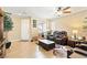 Cozy living room with tile floors, ceiling fan, and natural light at 2612 Tullamore Creek Ln, Laughlin, NV 89029
