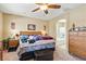Inviting main bedroom with a dresser, a ceiling fan, and an en-suite bathroom featuring a large soaking tub at 2612 Tullamore Creek Ln, Laughlin, NV 89029